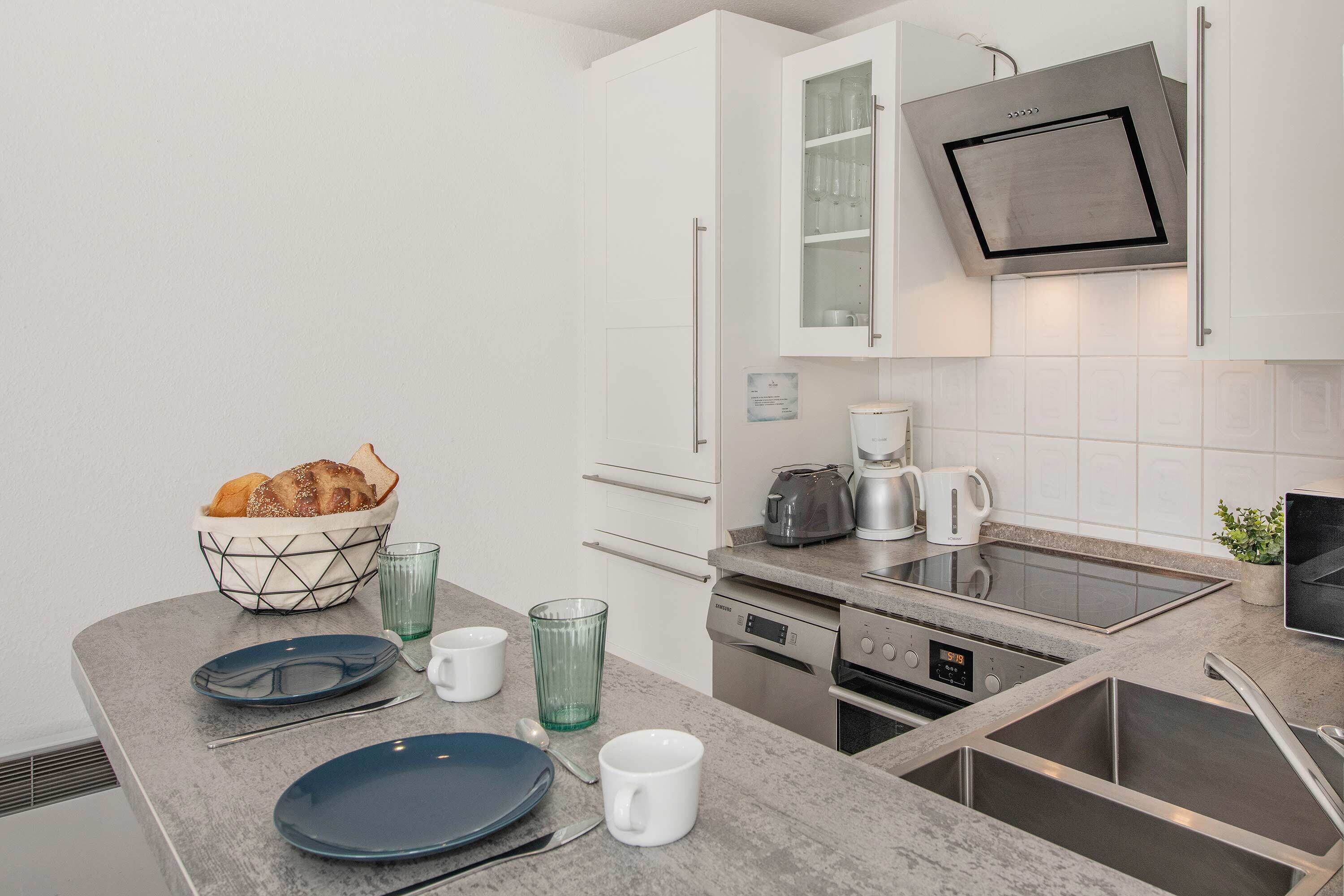 Coffee/tea maker, fridge, stovetop, toaster