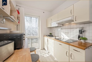 Fridge, microwave, stovetop, coffee/tea maker