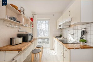 Fridge, microwave, stovetop, coffee/tea maker