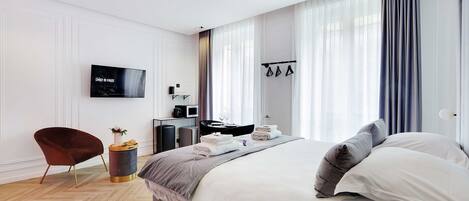 Apartament | Planxa i posts de planxar i roba de llit