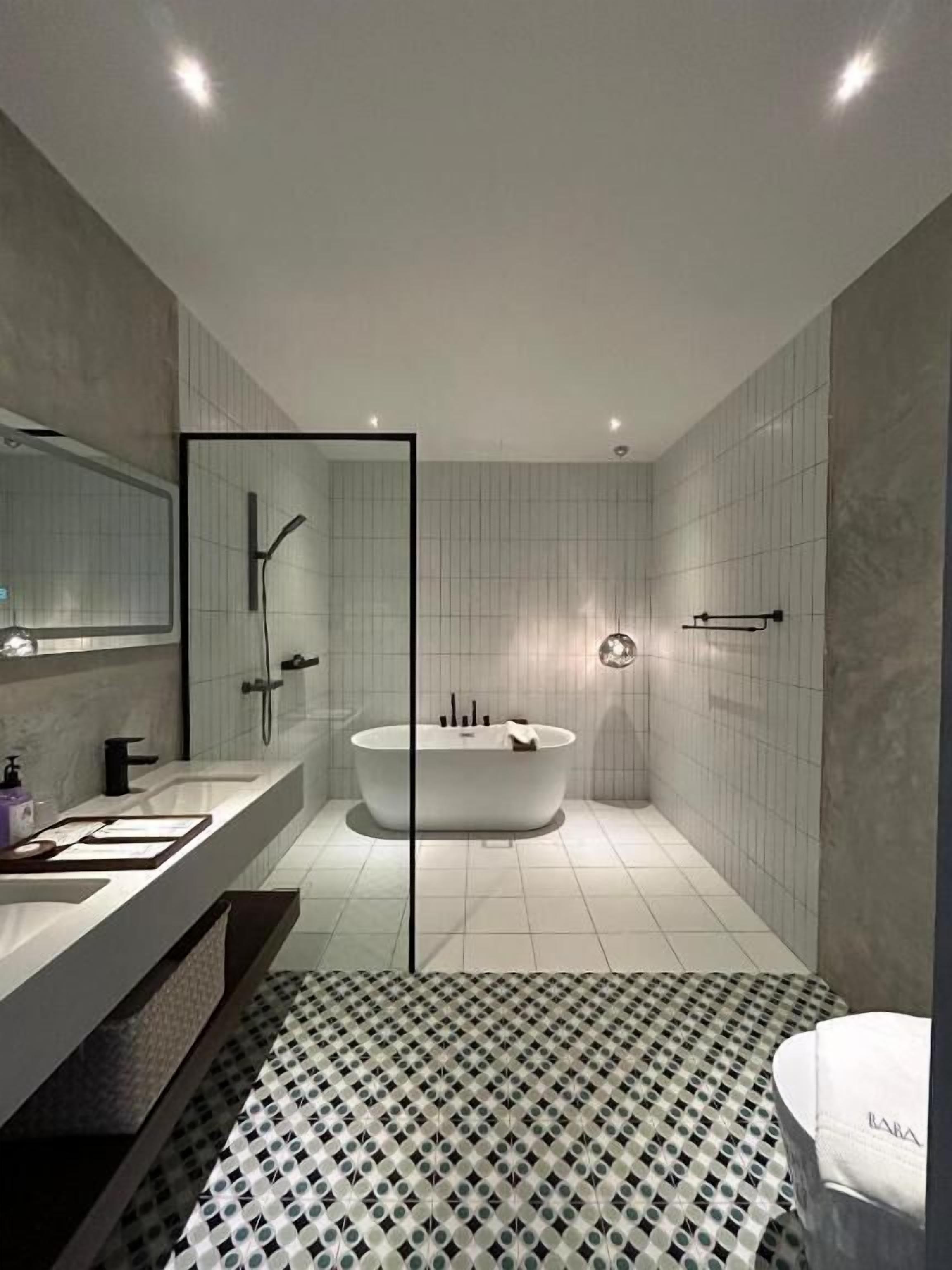 Separate tub and shower, free toiletries, hair dryer, slippers