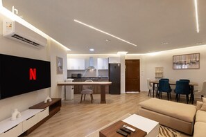 Apartment, Air conditioning, Garden View | Living area | 55-inch LCD TV with satellite channels - Cozy (New Cairo)