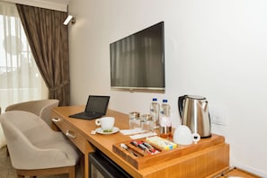 Deluxe Room, Multiple Beds, City View | Desk, laptop workspace, free WiFi