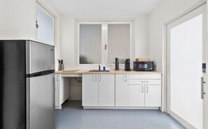 Fridge, microwave, stovetop, coffee/tea maker