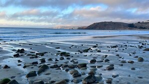 A beach with scattered rocks and a clear sky. - @ Marbella Lane - Ocean Views & Heavenly Sunset (Pacifica)