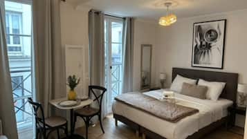 Apartment | Laptop workspace, iron/ironing board, bed sheets