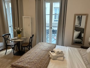 Apartment | Laptop workspace, iron/ironing board, bed sheets