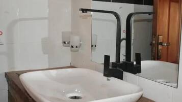 Deluxe Cottage, Balcony, Garden View | Bathroom | Shower, free toiletries, slippers, towels