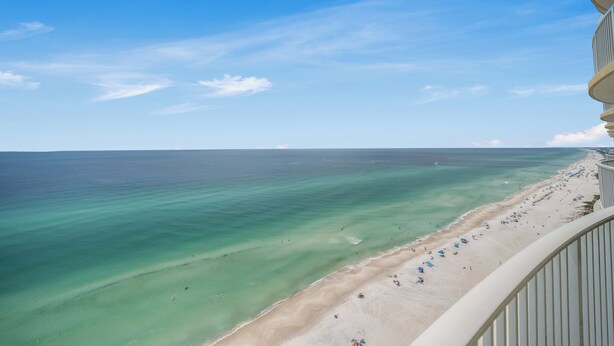 A beach with clear turquoise water and a sandy shore. - NEW Emerald Isle 2107 "Manta Ray Villa" Pool, FREE Perks&Beach Service for 4! (Panama City Beach)