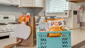 A kitchen counter with a blue crate containing popcorn and a bag of Popcorn seasoning. - 3 Mi to Icw: Coastal Carolina Home w/ Pool Access (Hampstead)