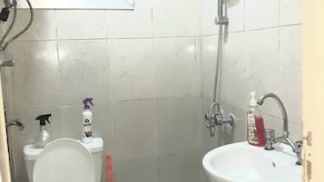 Shower, towels, soap, toilet paper