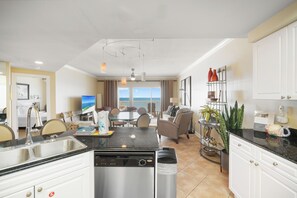 Fridge, microwave, coffee/tea maker, cookware/dishes/utensils