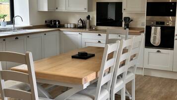 Saddle - Family Cottage with Private Courtyard, Pet Friendly | Private kitchen | Electric kettle, high chair