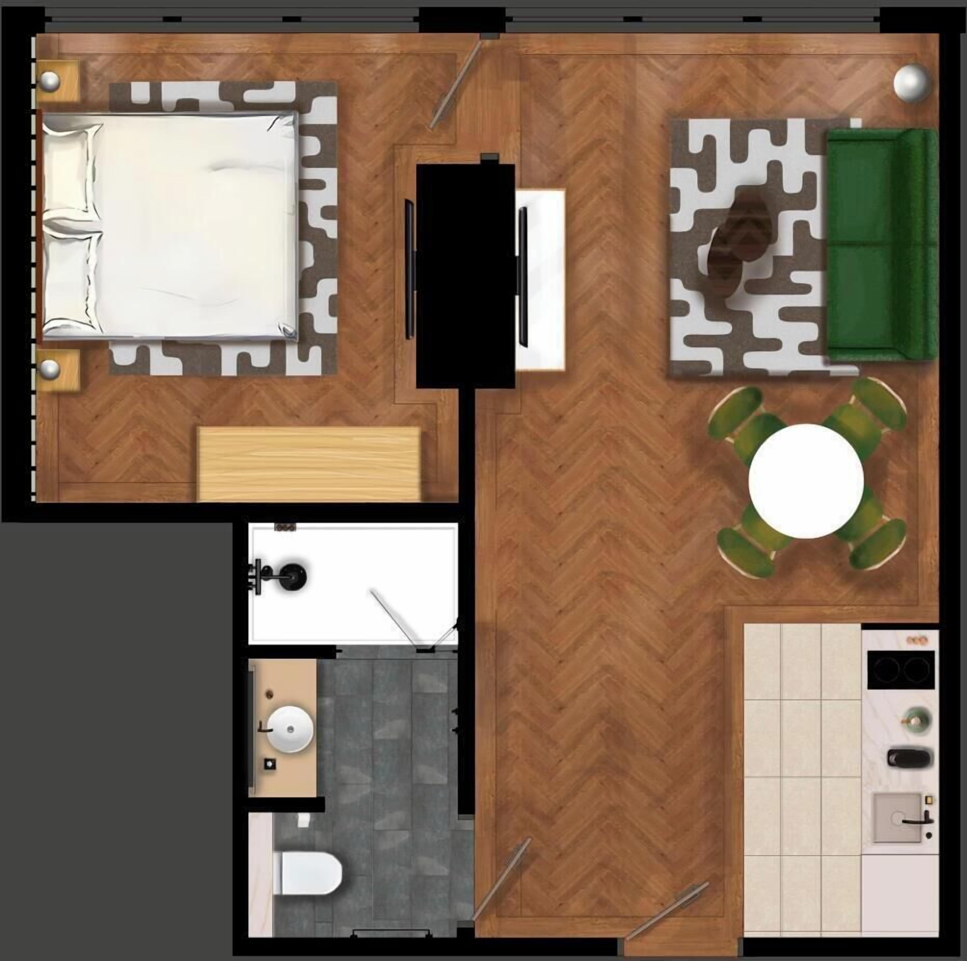 Una habitación con cama, escritorio, silla, sofá, una pequeña mesa con sillas, baño y kitchenette.