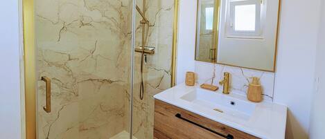 Shower, hair dryer, towels, soap