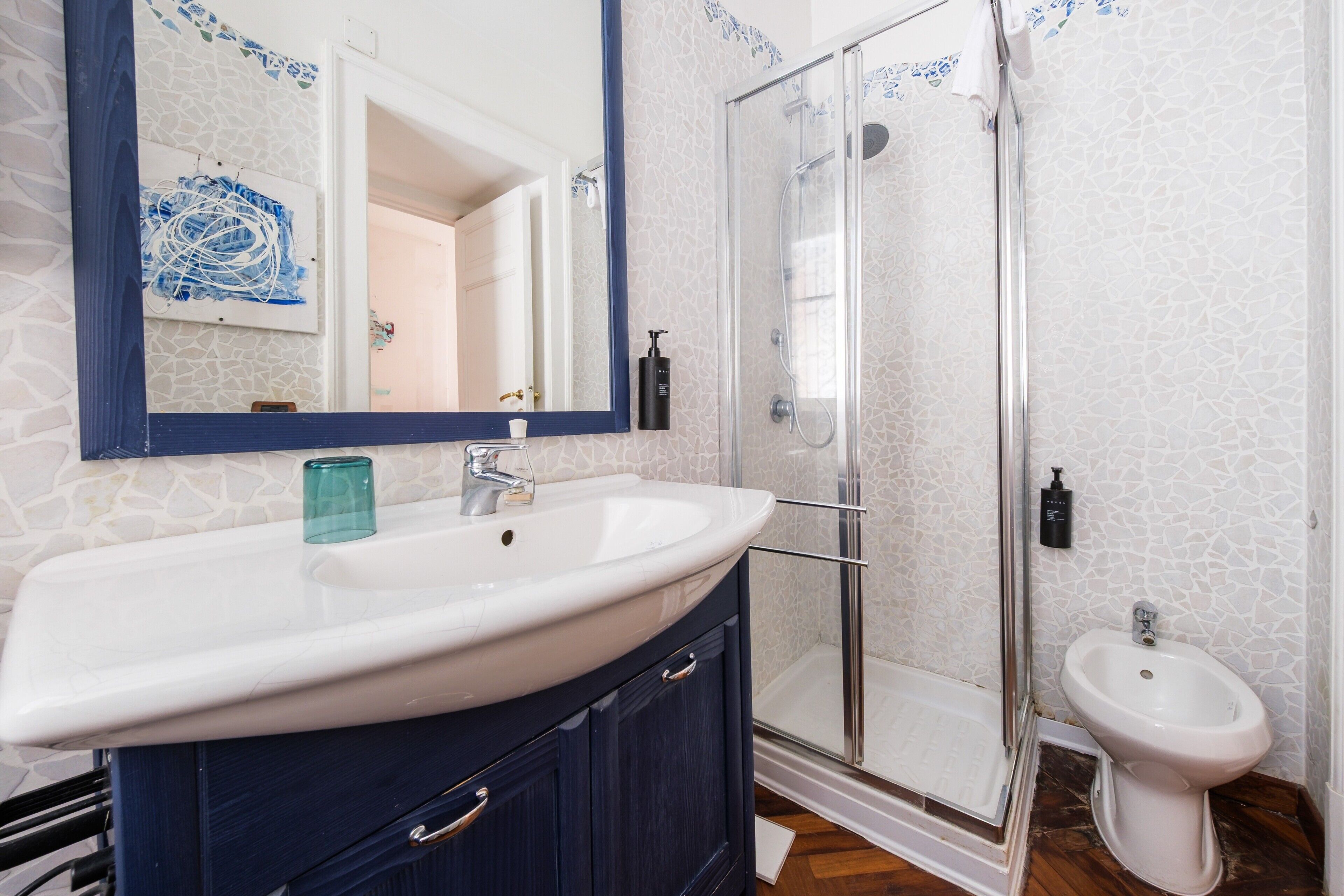 Shower, hair dryer, towels