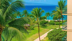 A tropical resort with a view of the ocean, palm trees, and a pathway leading to the beach. - Honua Kai | Ocean View 4 BR, Sleeps 12 | Car Incl. w/ 6+ Nights | HKH ML-1793 by KBM (Lahaina)