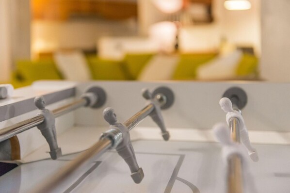 A close-up of a modern kitchen with stainless steel appliances and a neutral color scheme.