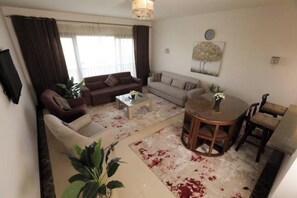 Living area - Pool view Duplex Near Auc (New Cairo City)