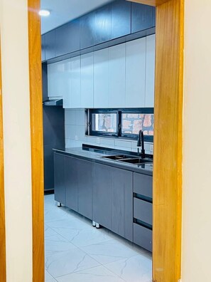 Fridge, microwave, stovetop, cookware/dishes/utensils