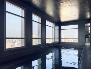 Indoor pool, outdoor pool, pool umbrellas, pool loungers