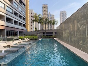 Indoor pool, outdoor pool, pool umbrellas, pool loungers