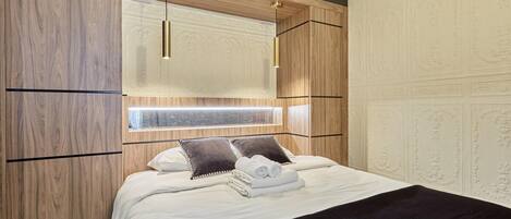 Apartment | Laptop workspace, iron/ironing board, bed sheets