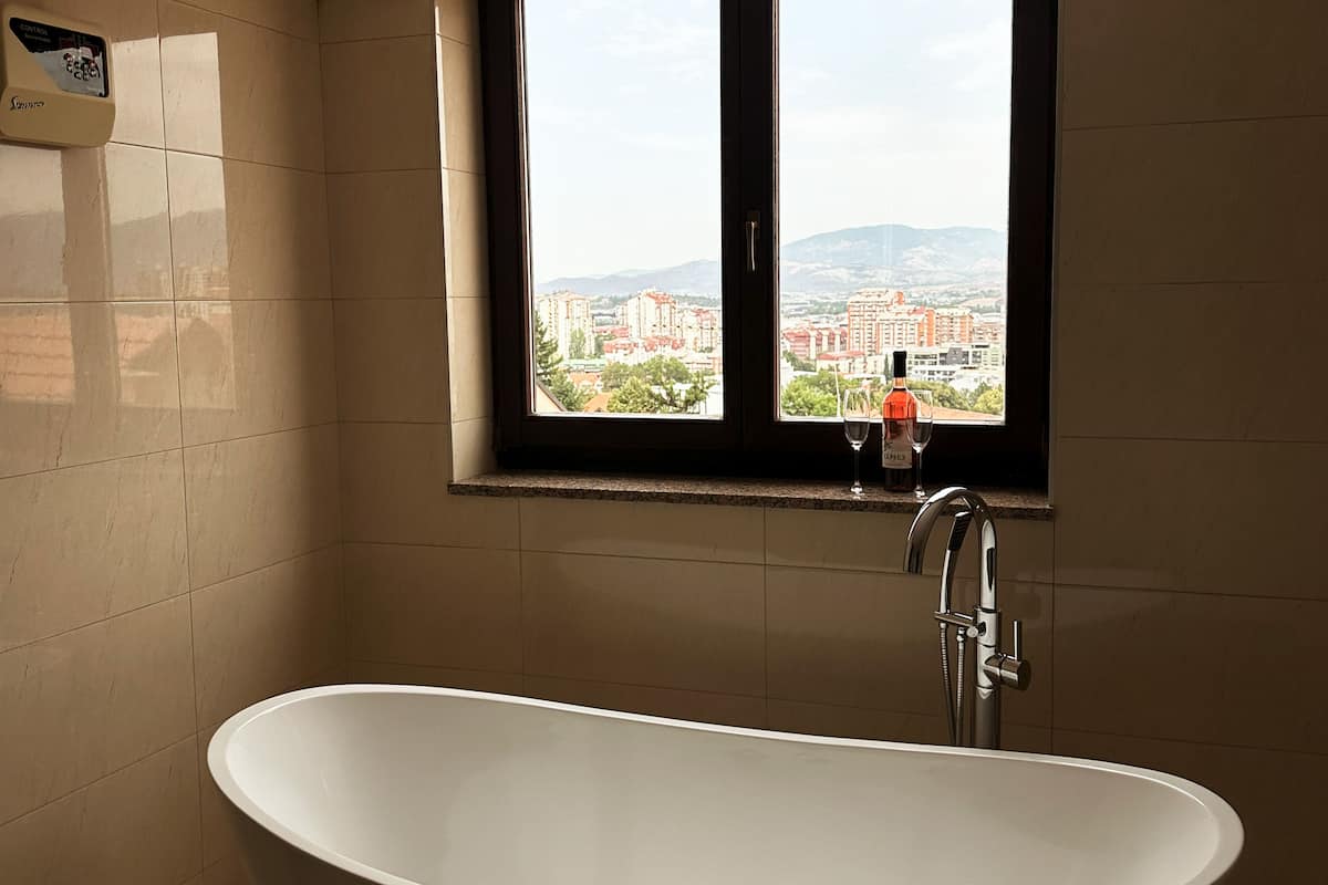 Luxury Room, City View | Bathroom | Combined shower/tub, hair dryer, slippers, towels