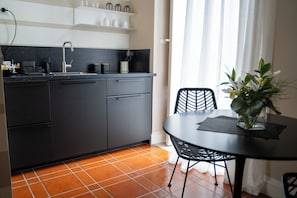 Deluxe Triple Room, Balcony, City View | Private kitchen