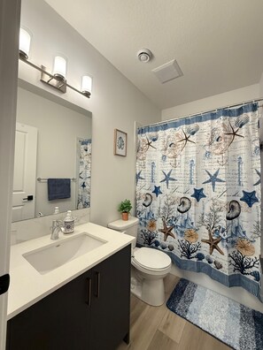 Hair dryer, towels, soap, toilet paper