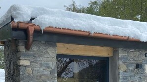A stone building with a dark entrance and a wooden staircase leading up. - Chalet at the foot of the ski resorts with spa (Landry)