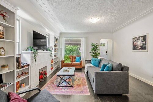 Big, fun-filled stay steps from Whyte Ave with yard, games, and coffee bar