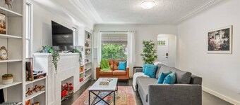 Big, fun-filled stay steps from Whyte Ave with yard, games, and coffee bar