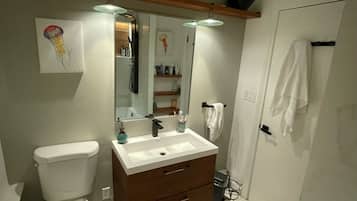 Shower, towels, soap, toilet paper