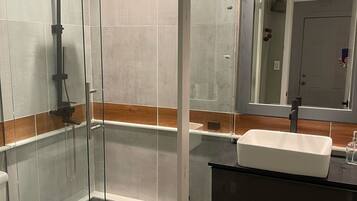 Shower, towels, soap, toilet paper