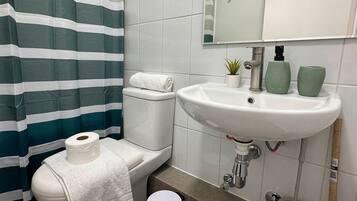 Apartment, Lagoon View | Bathroom | Combined shower/tub, hair dryer, towels, soap