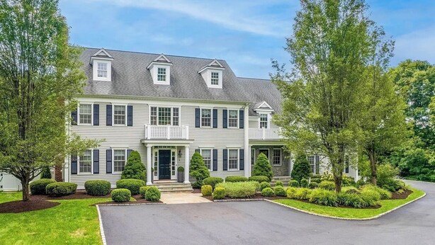 A two-story house with a front porch, a garage, and a driveway. - Luxury 5BR retreat w/3rd floor sleeps 26 adults; 1 mile to town; 1 month min (Ridgefield)