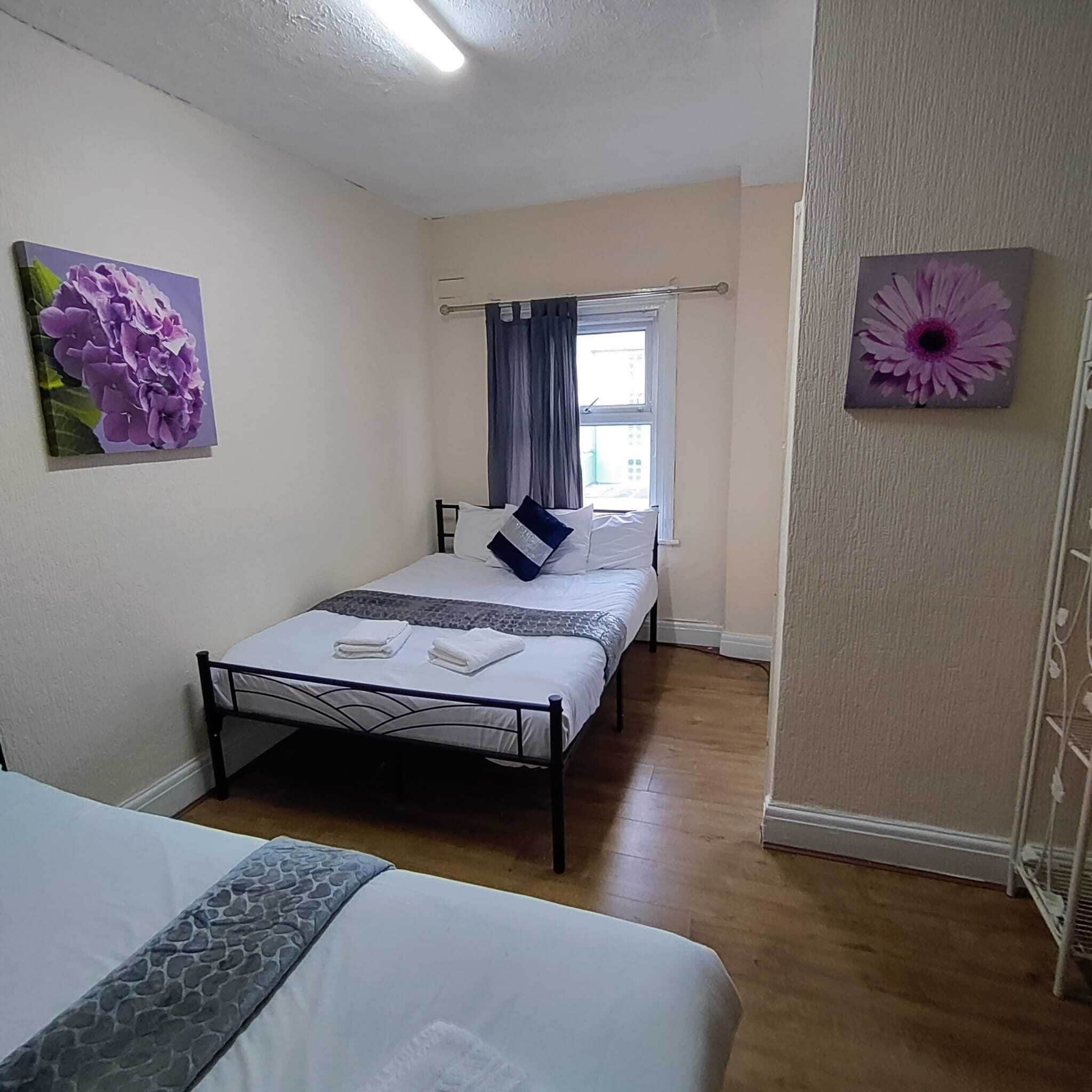 Habitación cuádruple familiar | Tabla de planchar con plancha