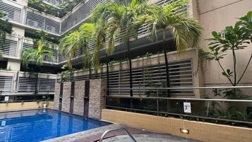 Outdoor pool, open 9:00 AM to 9:00 PM, pool loungers