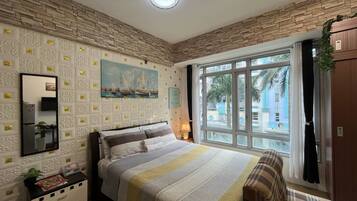 Desk, laptop workspace, blackout curtains, free WiFi