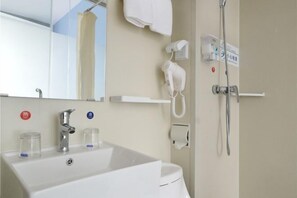 A bathroom with a sink, mirror, towel rack, shower, and a phone. - Yun xiang Holiday Hotel (Zhengzhou Xinzheng International Airport) (Xinzheng)