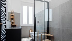 A modern bathroom with a glass shower enclosure, a black vanity, a wooden shelf, and a window providing natural light.