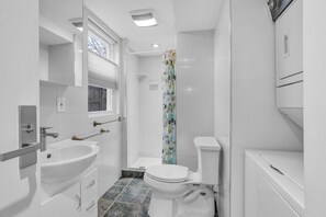 Shower, towels, soap, toilet paper