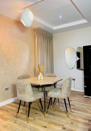 Family Apartment, Balcony, City View | In-room dining