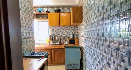 Apartment decorated with natural plants and artistic paintings.