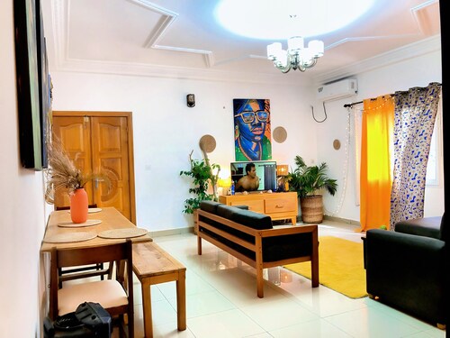 Apartment decorated with natural plants and artistic paintings.