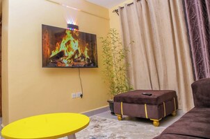Classic Apartment, City View | Living area | 32-inch Smart TV with digital channels