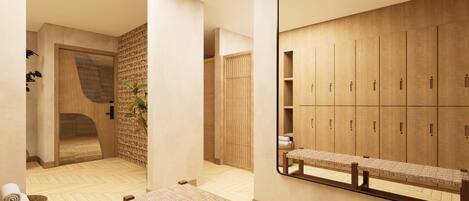 Un baño moderno con un espejo grande, taquillas de madera, un banco y un tapete tejido.
