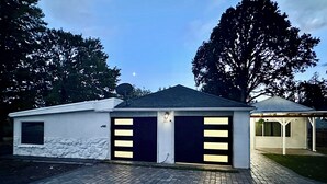 A single-story building with two garage doors, a satellite dish, and a small attached structure. - 2 Private Acres - 2 Houses - 5 Bed Rooms 4 Bath - 2 Kitchens - Single Level  (Hillsboro)