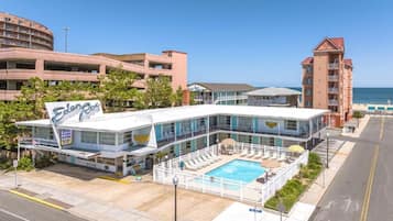 Seasonal outdoor pool, open 9:00 AM to 9:00 PM, pool umbrellas